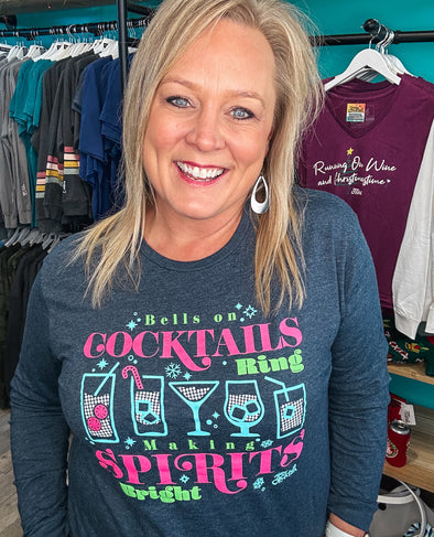 Show your cheer and holiday spirit by wearing this festive long sleeve holiday/christmas tee.  Featuring candy canes, snowflakes and cocktails, as well as bright 'neon christmas' colors